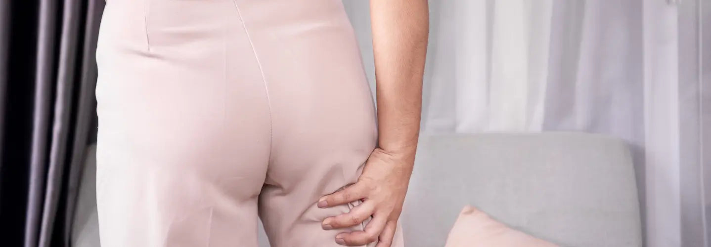 Person considering a local home light device for sciatica-like leg symptoms